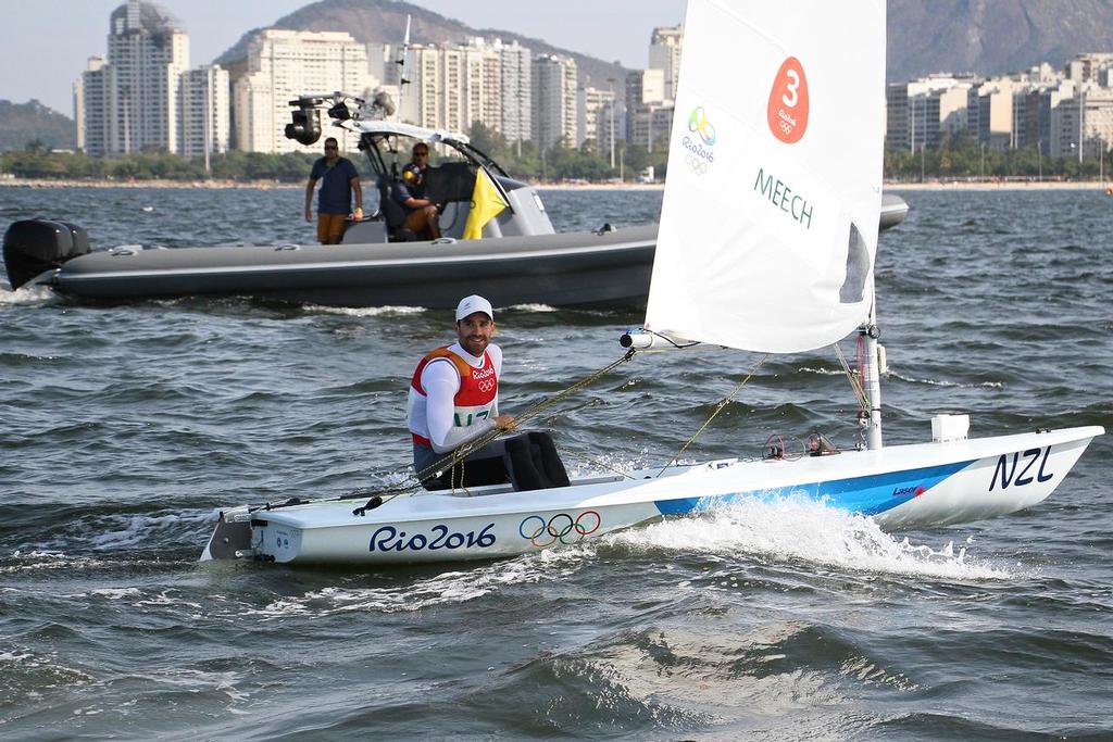 Sam Meech (NZL) seconds after crossing the finish line to win the Bronze Medal in the mens Laser class - 2016 Olympics © Richard Gladwell www.photosport.co.nz